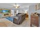 Spacious living room featuring comfortable leather furniture and a large patterned rug at 141 Greenfield Rd, Winter Haven, FL 33884