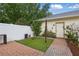 Backyard featuring artificial grass, brick pavers, and privacy fence, perfect for low-maintenance enjoyment at 14467 Prunningwood Pl, Winter Garden, FL 34787