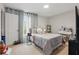 Bright bedroom featuring a cozy bed, natural light, and a serene atmosphere at 14467 Prunningwood Pl, Winter Garden, FL 34787