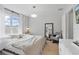 Serene bedroom with neutral tones, cozy textiles, and ample natural light at 14467 Prunningwood Pl, Winter Garden, FL 34787