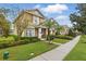 Charming two-story home with a well-manicured front yard and inviting curb appeal at 14467 Prunningwood Pl, Winter Garden, FL 34787