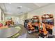 Game room includes arcade games and a play area at 14467 Prunningwood Pl, Winter Garden, FL 34787