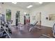 Spacious gym offering a variety of exercise machines, natural light, and fitness amenities at 14467 Prunningwood Pl, Winter Garden, FL 34787