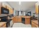 Well-equipped kitchen features updated appliances and overlooks the adjacent living area at 14467 Prunningwood Pl, Winter Garden, FL 34787