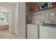 Laundry area with washer, dryer, and storage space at 14467 Prunningwood Pl, Winter Garden, FL 34787