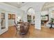 Elegant lounge features hardwood floors, decorative archways, and a community map at 14467 Prunningwood Pl, Winter Garden, FL 34787
