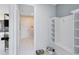 Well-organized mud room with built-in bench, storage shelves, and convenient access to the home at 15343 Rising View Dr, Montverde, FL 34756