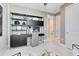 The modern office features a sleek desk and chair, built-in shelving, and decor accents at 15343 Rising View Dr, Montverde, FL 34756
