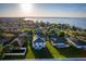 Beautiful aerial view of lakeside homes and neighborhood with mature trees and sparkling blue water at 181 Zachary Wade St, Winter Garden, FL 34787