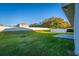 Expansive backyard featuring well-maintained lawn, privacy fence and concrete patio area at 181 Zachary Wade St, Winter Garden, FL 34787