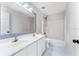 Bright bathroom featuring double sinks, tub/shower combo, and a large mirror at 181 Zachary Wade St, Winter Garden, FL 34787