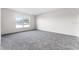 Bedroom featuring neutral walls, gray carpet and a window with natural light at 181 Zachary Wade St, Winter Garden, FL 34787