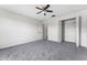 Bedroom featuring neutral walls, gray carpet, ceiling fan and closet at 181 Zachary Wade St, Winter Garden, FL 34787