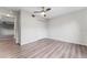 Bright, airy bedroom with a ceiling fan, hardwood floors, a closet, and a light neutral color palette at 181 Zachary Wade St, Winter Garden, FL 34787