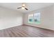 Bedroom with a window and ceiling fan features natural light and wood flooring at 181 Zachary Wade St, Winter Garden, FL 34787