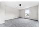 Bright bedroom featuring neutral walls, gray carpet and a window with natural light at 181 Zachary Wade St, Winter Garden, FL 34787