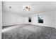 Large bedroom with carpeting, two windows and a ceiling fan at 181 Zachary Wade St, Winter Garden, FL 34787