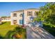 Charming two-story home featuring a manicured lawn, blue front door and attached two-car garage at 181 Zachary Wade St, Winter Garden, FL 34787