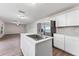 Open-concept kitchen with stainless steel appliances and large kitchen island at 181 Zachary Wade St, Winter Garden, FL 34787
