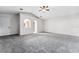 Bright living room features neutral paint, carpet flooring, and ceiling fan at 181 Zachary Wade St, Winter Garden, FL 34787
