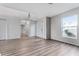 Spacious living room with wood floors, stairs, and bright natural light at 181 Zachary Wade St, Winter Garden, FL 34787