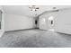 Bright living room features neutral paint, carpet flooring, and ceiling fan at 181 Zachary Wade St, Winter Garden, FL 34787