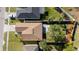 Aerial view of a landscaped backyard including a patio and a privacy fence at 1832 Corner Meadow Cir, Orlando, FL 32820