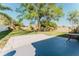 Spacious backyard featuring a well-maintained lawn and a patio with outdoor seating at 1832 Corner Meadow Cir, Orlando, FL 32820