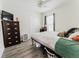 Simple bedroom with wood floors, closet and ceiling fan at 1832 Corner Meadow Cir, Orlando, FL 32820