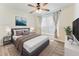 Inviting bedroom with a comfortable bed, ceiling fan, and natural light at 1832 Corner Meadow Cir, Orlando, FL 32820