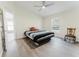 Comfortable bedroom with natural light, a ceiling fan, hardwood floors, and neutral paint at 1832 Corner Meadow Cir, Orlando, FL 32820