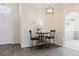 Dining area features modern light fixtures, neutral walls, and wood-look flooring at 1832 Corner Meadow Cir, Orlando, FL 32820