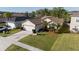 Charming single-story home with well-manicured lawn, landscaping, and a two-car garage at 1832 Corner Meadow Cir, Orlando, FL 32820
