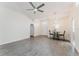 Bright and airy living room featuring modern light fixtures, neutral walls, and wood-look flooring at 1832 Corner Meadow Cir, Orlando, FL 32820