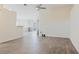 Spacious living room with a ceiling fan, hardwood floors, and a view into another room at 1832 Corner Meadow Cir, Orlando, FL 32820