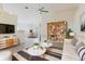 Bright living room featuring modern furniture, decor, and ceiling fan at 1832 Corner Meadow Cir, Orlando, FL 32820
