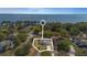 Inviting single-story home with a well-maintained yard, set against a serene waterfront backdrop at 2011 Oakbend Dr, Eustis, FL 32726