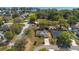 Lovely single-level home with a spacious driveway and green surroundings near the water at 2011 Oakbend Dr, Eustis, FL 32726