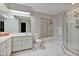 Bathroom featuring a vanity, a toilet, white tile floors, and a glass door shower at 2011 Oakbend Dr, Eustis, FL 32726