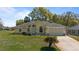 Charming front exterior with well-manicured lawn and inviting curb appeal at 2011 Oakbend Dr, Eustis, FL 32726
