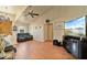 Inviting living room features vaulted ceilings, wood floors, and a comfortable seating area at 2011 Oakbend Dr, Eustis, FL 32726