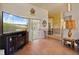 Bright living area showcasing wood flooring and sliding doors to the patio, perfect for entertaining at 2011 Oakbend Dr, Eustis, FL 32726