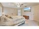 Spacious main bedroom with neutral paint, carpet, and a TV on the wall at 2011 Oakbend Dr, Eustis, FL 32726