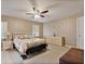 Spacious main bedroom with neutral paint, carpet, and a ceiling fan at 2011 Oakbend Dr, Eustis, FL 32726