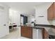 Open-concept kitchen with wood cabinetry, stainless steel appliances, and adjacent dining area at 202 E South St # 5046, Orlando, FL 32801