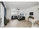 Comfortable living room with a leather sectional sofa, stylish decor, and natural light at 202 E South St # 5046, Orlando, FL 32801