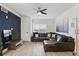 Comfortable living room with a leather sectional sofa, stylish decor, and natural light at 202 E South St # 5046, Orlando, FL 32801