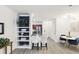 Open concept living room featuring hardwood flooring, modern lighting, and bar seating at the kitchen counter at 202 E South St # 5046, Orlando, FL 32801
