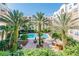 Stunning resort-style pool area with lush landscaping and comfortable lounge seating amidst the beautiful buildings at 202 E South St # 5046, Orlando, FL 32801