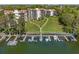 Aerial view of the complex with dock, boat slips, and lush surrounding trees at 204 Quayside Cir # 501, Maitland, FL 32751